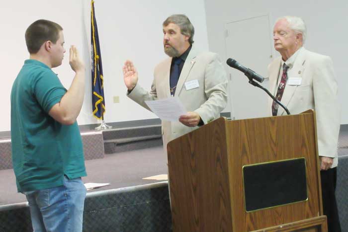 Brian Poerschman is sworn in as a new member of the 16th Regiment, SC, Volunteers, Camp 36 of the Sons of Confederate Veterans. He was sworn in by Camp Commander Frank Tucker as 1st Lt. Commander Larry Waddell looks on.