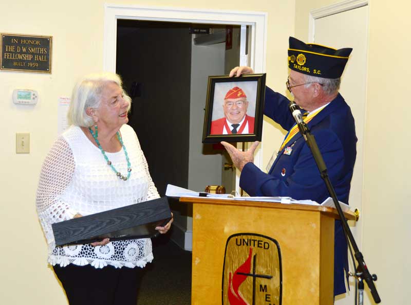 At the August General Meeting of American Legion Post 214 Commander Clyde Rector presented Sara Jo Moore Widow of the late World War 11 Marine Veteran the Flag from his coffin cased and a framed photograph of Bill taken by Tony Dunn.
