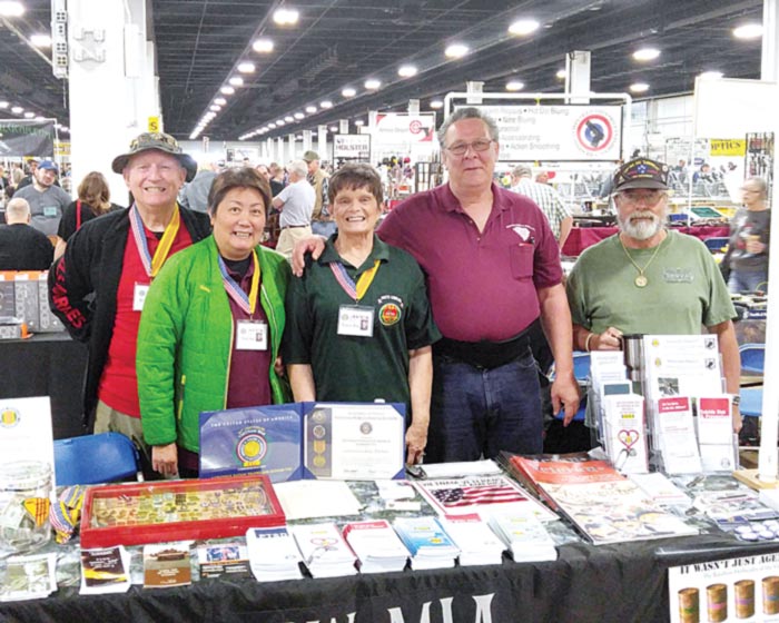 Member of Vietnam Veterans of America talked with visitors about Vietnam issues and the lingering effects of Agent Orange at the TD Convention Center Gun Show. Left to right: Ron Hall, Bang Hall, Nancy Nix, Duane Kelley and Johnny Cotrone.
