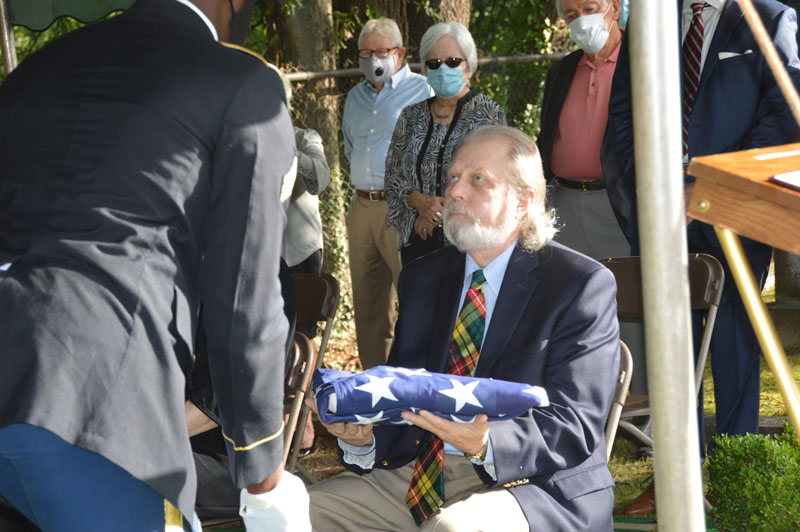 Cecil D. Buchanan's son David Buchanan II, received the flag in memory of his father.