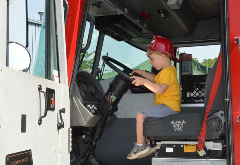 Two-year-old Jude Zukowsky sits in Fire Truck especially equipped for Greenville County Emergency Response Team during Sgt. Brian Donnelly Memorial Safety Awareness Day on Saturday, May 4 at the Eastside Family YMCA in Taylors, SC. This day is a day of honoring Sgt. Brian Donnelly for his loyal commitment and dedication to the safety of those in the upstate by sponsoring a Safety Awareness Day for the community.