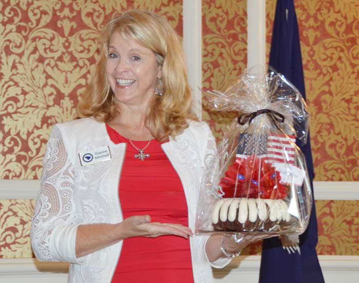 Greenville County Republican Women's Club 1st Vice President Dianne Mitchell holds a patriotic cake baked by Nothing Bundt Cakes® which was raffled off to those who attended the GCRWC Americanism Luncheon.