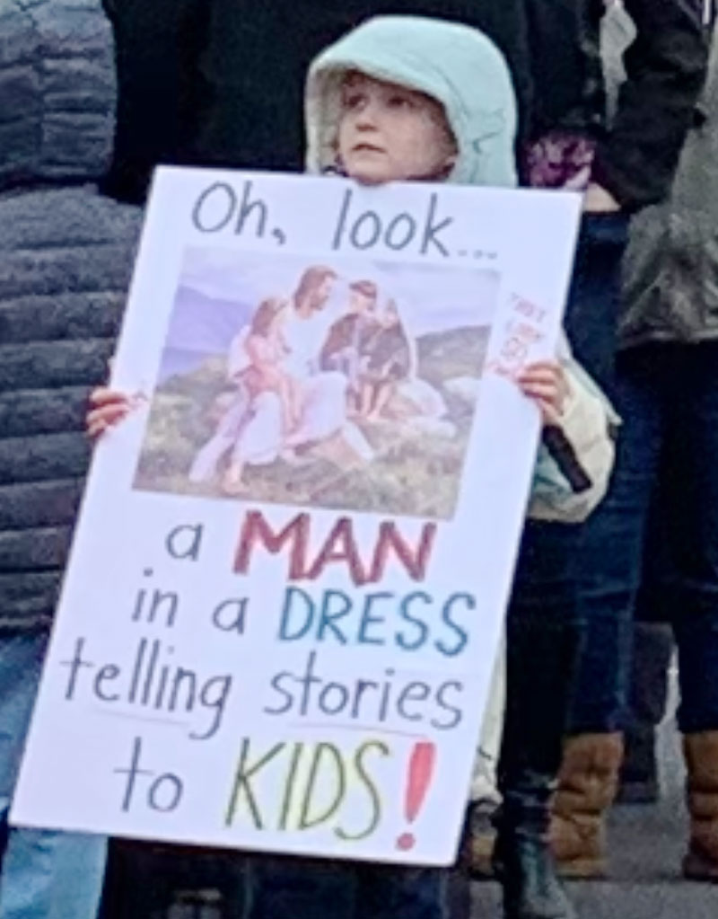 Young girl holding a sign in support for the Drag Queen Story Hour that took place at a Greenville Library Branch in Five Forks which is located within Greenville County, SC. - Photo by Wilkyns Aponte