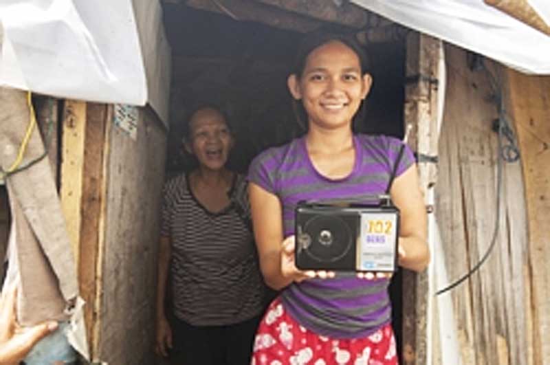 FEBC's free radio giveaway provides sets that enable people who would otherwise have no access to Christian broadcasting to hear the gospel, like this recipient in the Philippines.