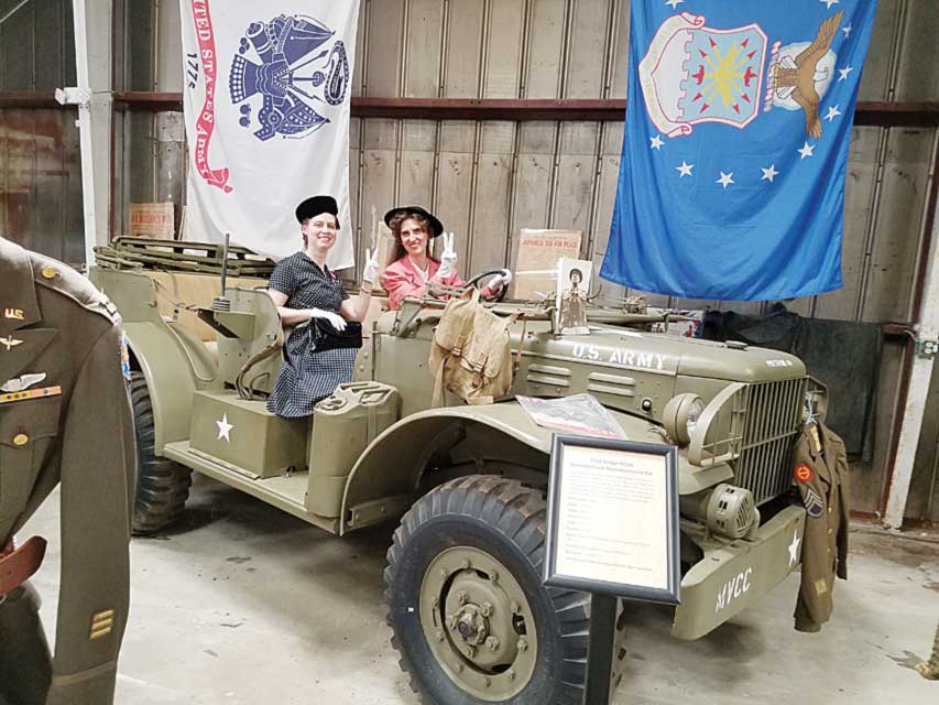 Heather & Raquelle Sheen pose in a 1943 Dodge WC56 Command and Reconnaissance car. 