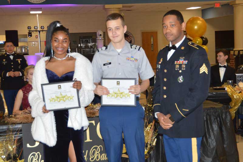 Sgt. Parks presented US Army Enlistment Certificates to Cadet Hellams and Cadet Burns who will be in the US Army after high school graduation.