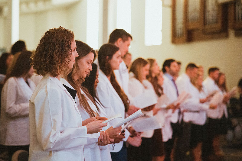 NGU PA students led in the PA Professional Oath at its annual white coat and hooding ceremonies for the Master of Medical Science in PA Studies on Friday, December 10.