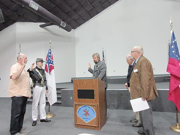 Clyde W. Rector, at left, and Jackson Lee Tucker were sworn in as new members of the Sons of Confederate Veterans by 16th Regiment Commander Frank Tucker, Camp Chaplain Pastor  Mark Evans and Larry Waddell.