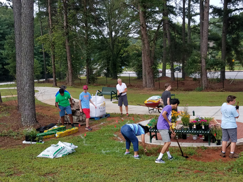 Fulfilling an Eagle Scout requirement, Pratamesh Ramasubramanian, with the assistance of his friends, donated, installed and planted items to add to Washington Center’s new Nature Trail.  